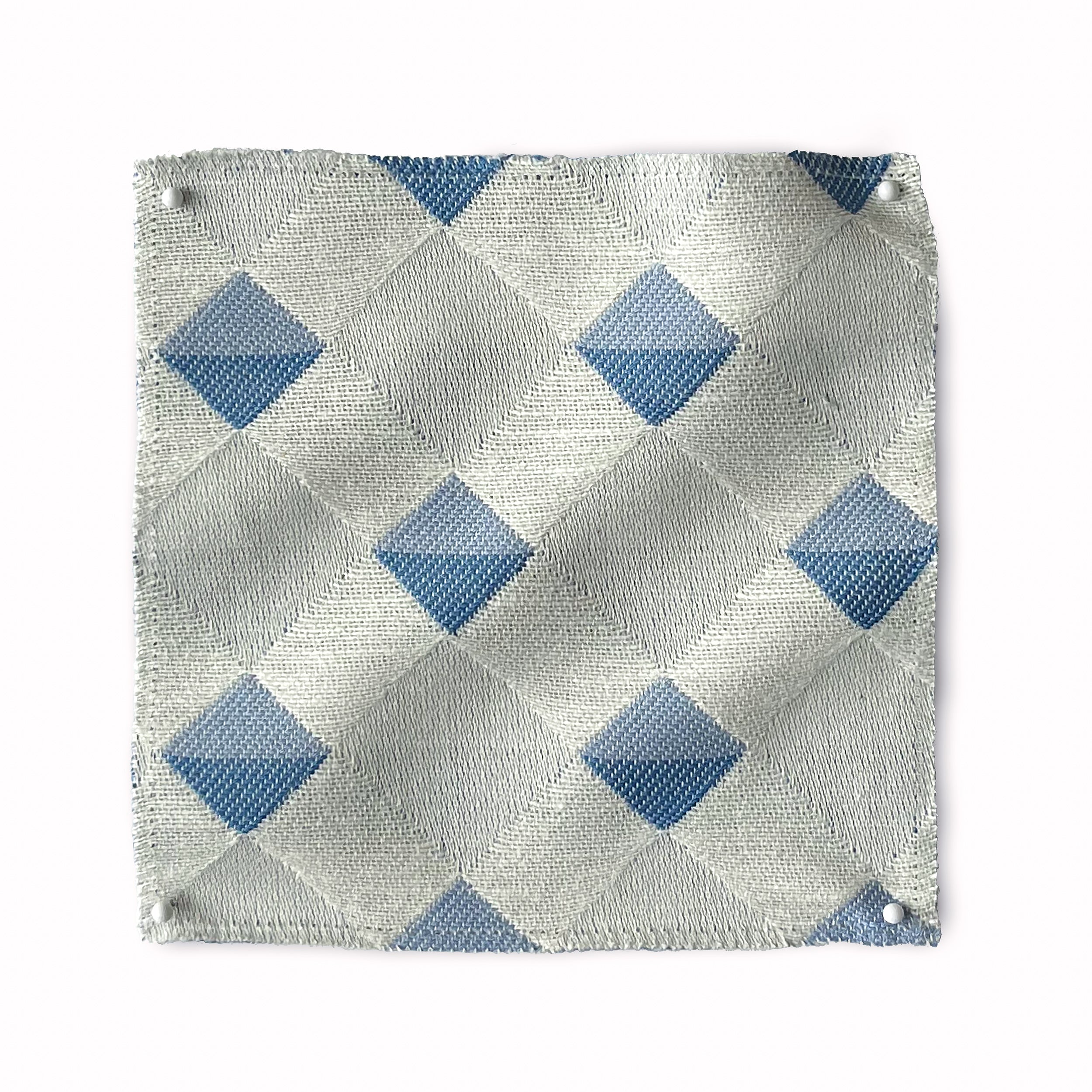 Square fabric swatch in a textural diamond lattice print in blue on a cream field.