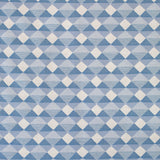 Detail of fabric in a textural diamond lattice print in cream on a blue field.