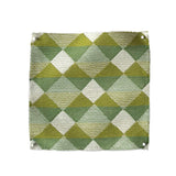 Square fabric swatch in a textural diamond lattice print in cream on a green and mustard field.