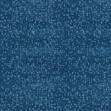 Detail of fabric in an abstract dotted pattern in blue on a mottled navy field.