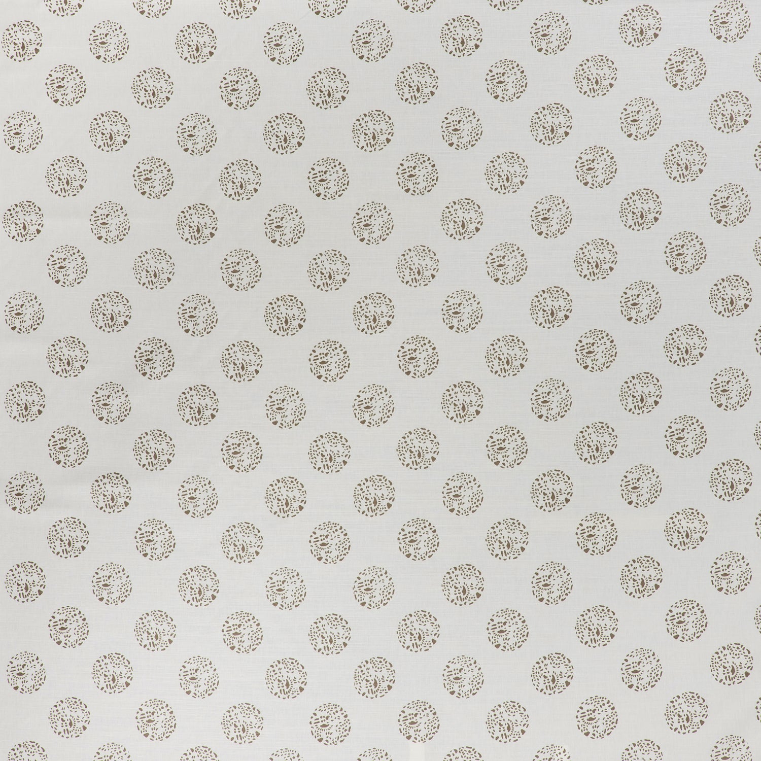 printed cotton fabric in a repeating dotted pattern in brown on a cream field.