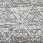 Broadloom carpet sample in a textural stacked triangle pattern in white and oatmeal.