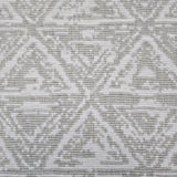 Broadloom carpet sample in a textural stacked triangle pattern in white and light grey