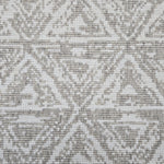 Broadloom carpet sample in a textural stacked triangle pattern in white and taupe.