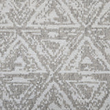 Broadloom carpet sample in a textural stacked triangle pattern in white and taupe.