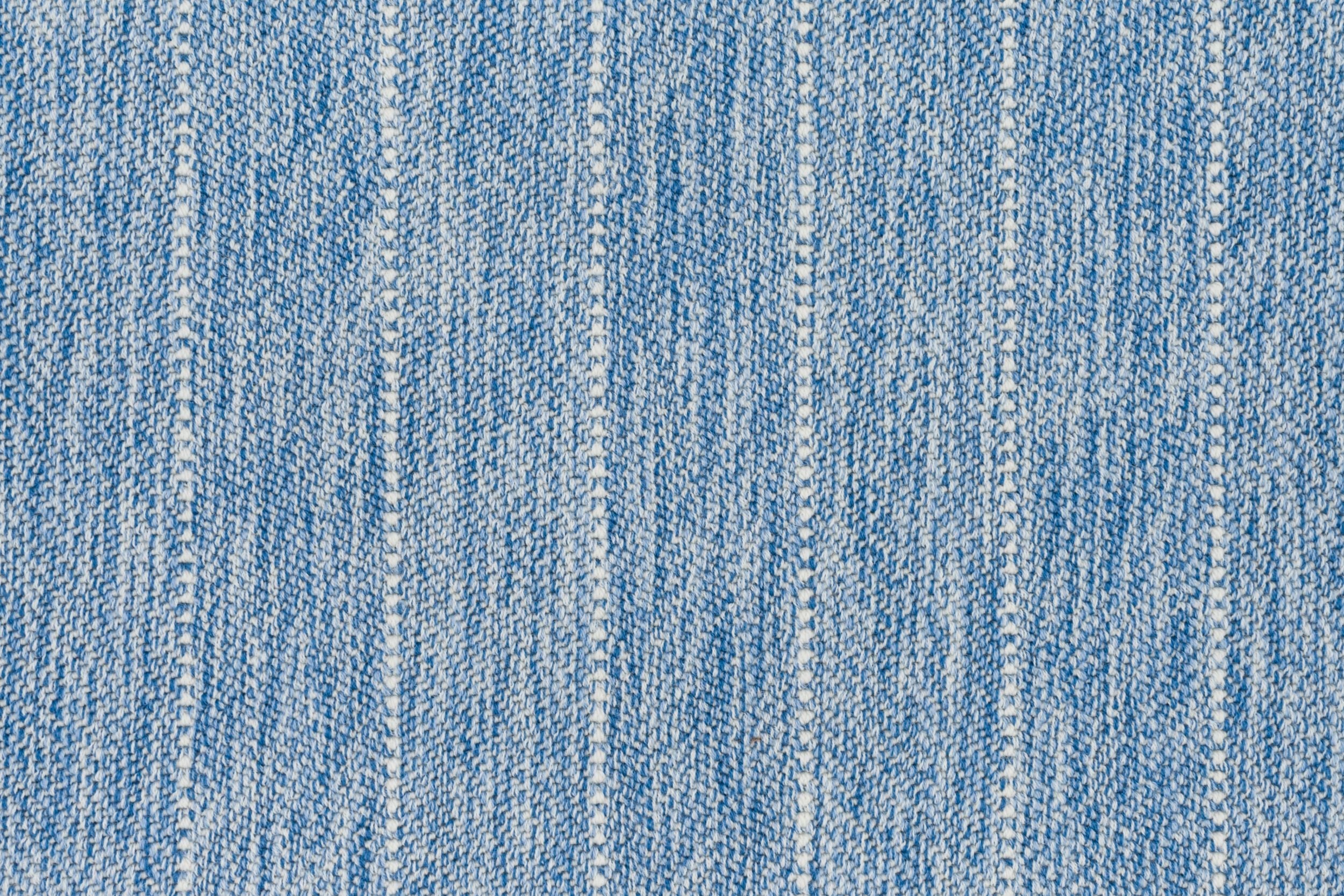 Broadloom carpet in a herringbone stripe pattern in heather blue.