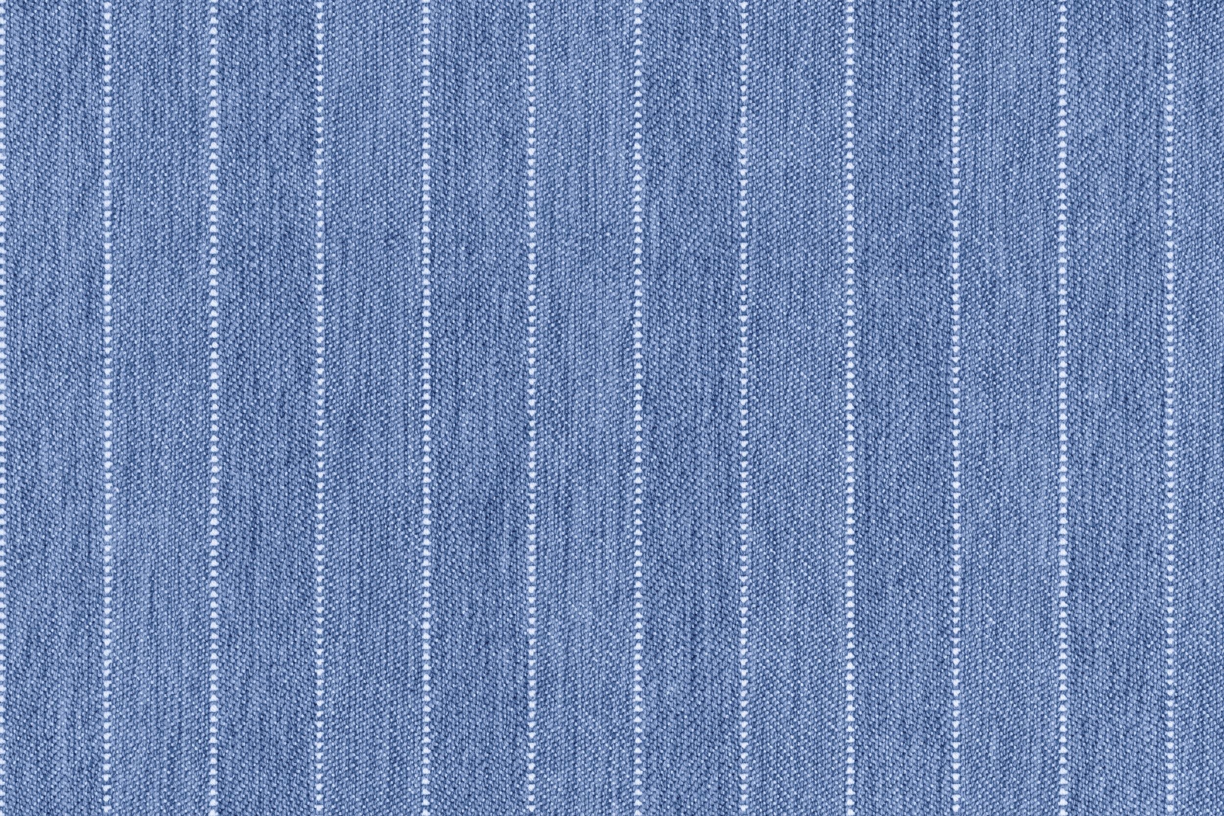 Broadloom carpet in a herringbone stripe pattern in blue.