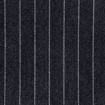 Broadloom carpet in a herringbone stripe pattern in black and white. 