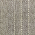 Broadloom carpet in a herringbone stripe pattern in taupe.