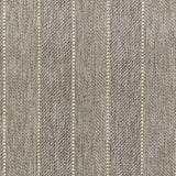 Broadloom carpet in a herringbone stripe pattern in taupe.