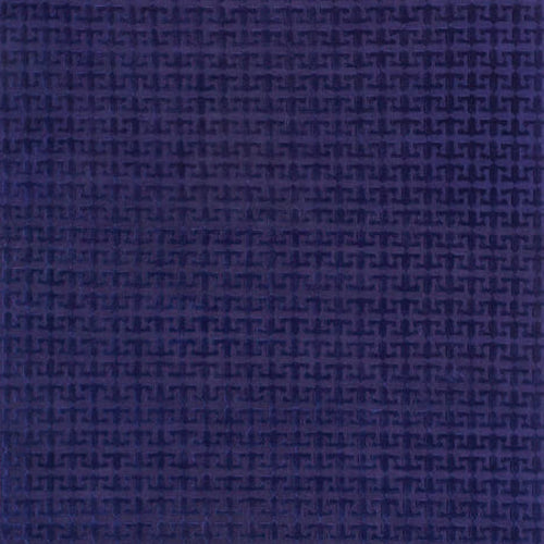 Handknotted rug in a geometric pattern in blue. 