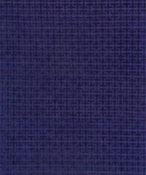 Handknotted rug in a geometric pattern in blue. 