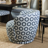 Blue patterned chair in a room with furniture and decor