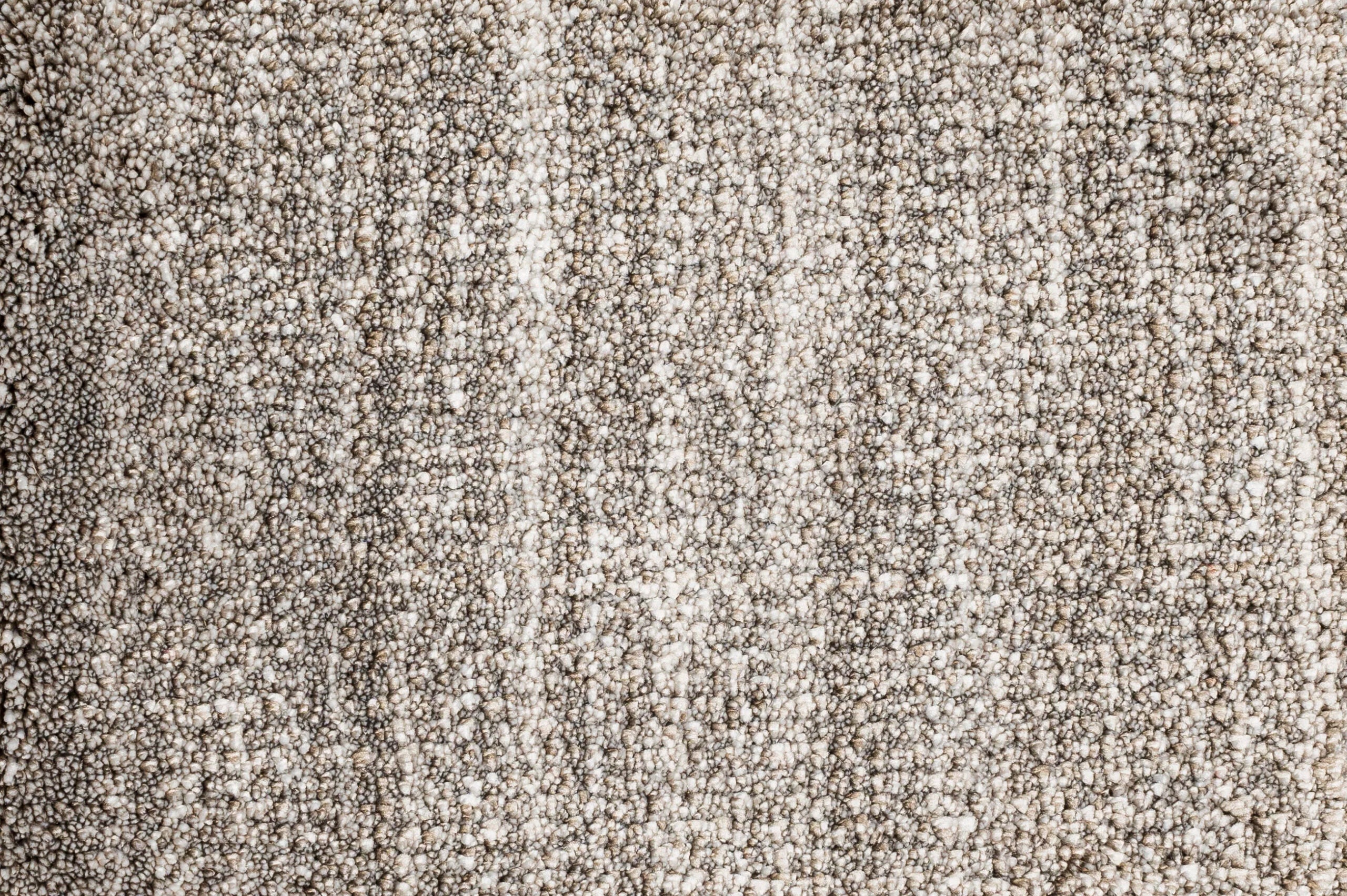 Broadloom carpet in cut pile in striated oatmeal.