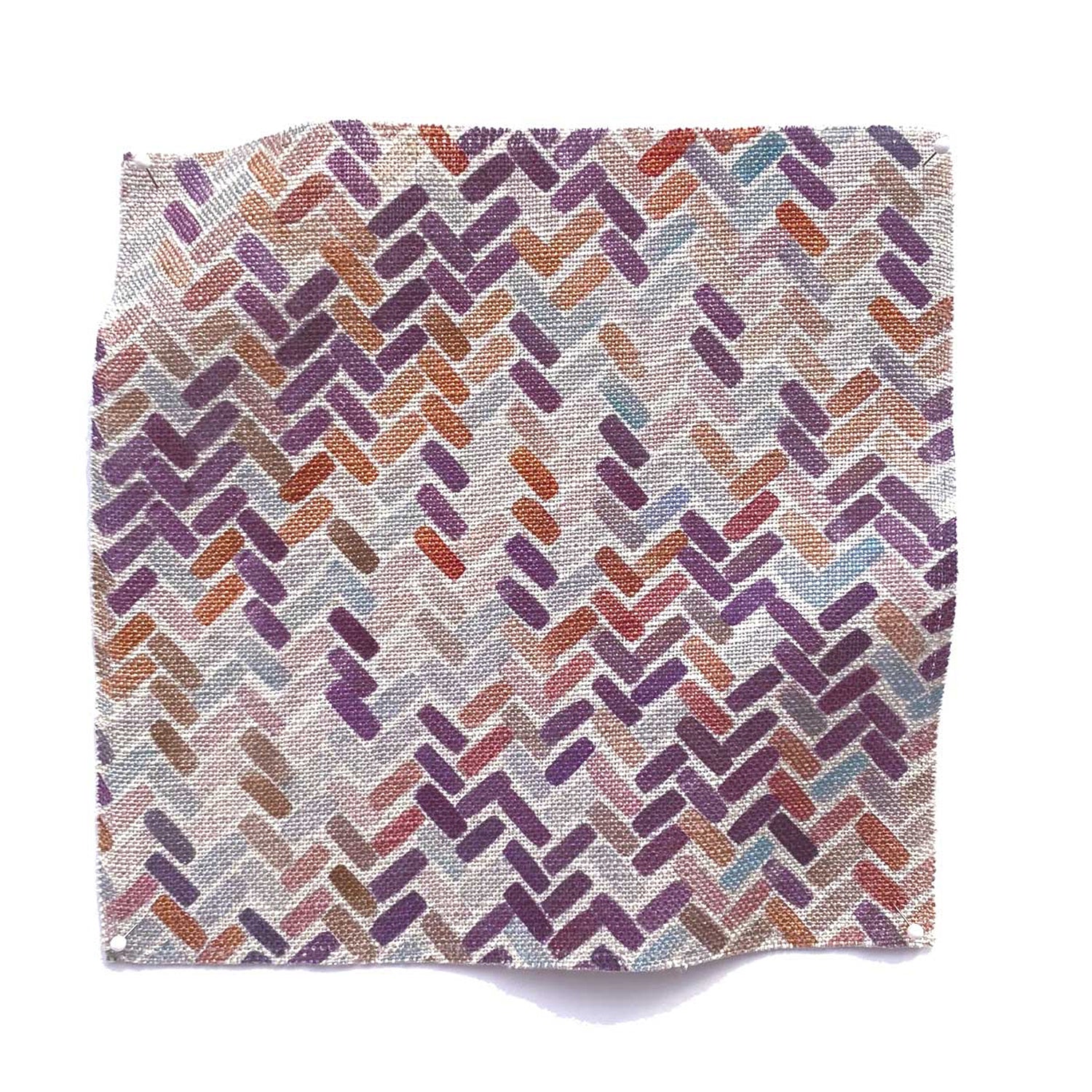 Square fabric swatch in a thatched herringbone pattern in shades of pink, purple, blue and tan.