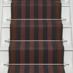 Striped flatweave runner in red ran and black on white staircase