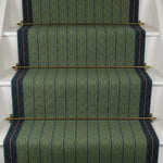 Striped flatweave runner in green and blue on white staircase