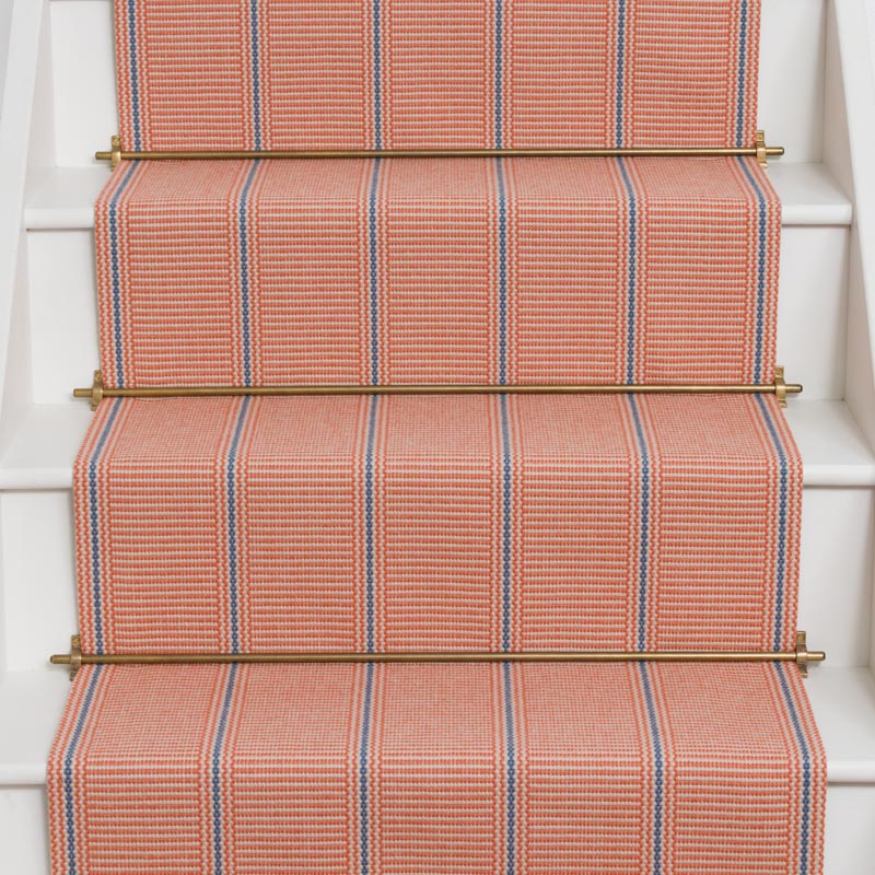 Striped flatweave runner in pink and blue on white staircase