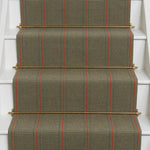 Striped flatweave runner in green and red on white staircase