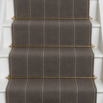 Striped flatweave runner in dark brown on white staircase