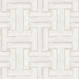 Detail of cream wallpaper in a large-scale interlocking geometric print.