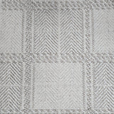 Broadloom carpet in wide box checkerboard pattern in cream and grey.