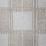 Broadloom carpet in wide box checkerboard pattern in cream and tan.