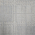 Broadloom carpet in wide box checkerboard pattern in light blue and cream. 