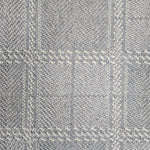 Broadloom carpet in wide box checkerboard pattern in cream and light blue.