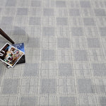 Gray checkered carpet with a magazine on top