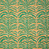 Detail of fabric in a linear botanical print in green on a mottled cream and orange field.