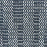 printed linen fabric in a repeating knotted pattern in indigo on a white field.