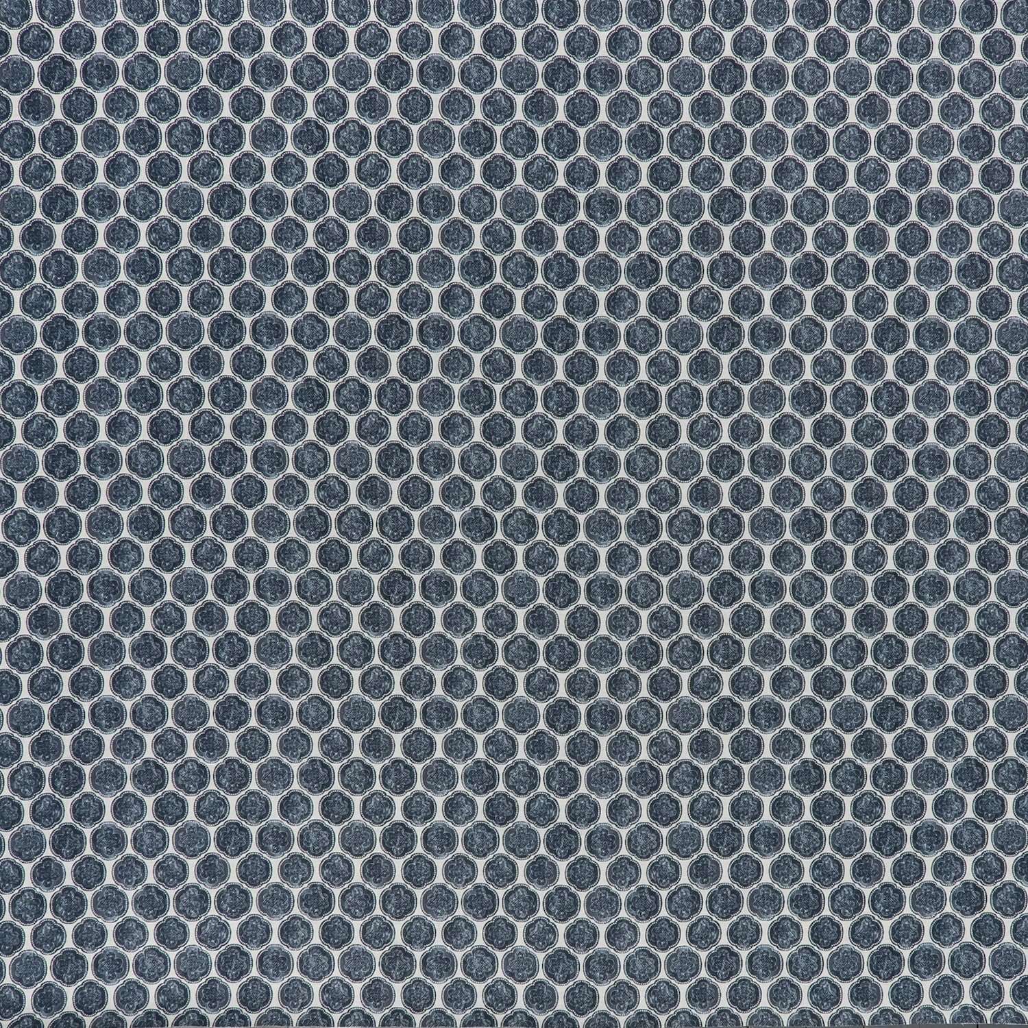 printed linen fabric in a repeating knotted pattern in indigo on a white field.