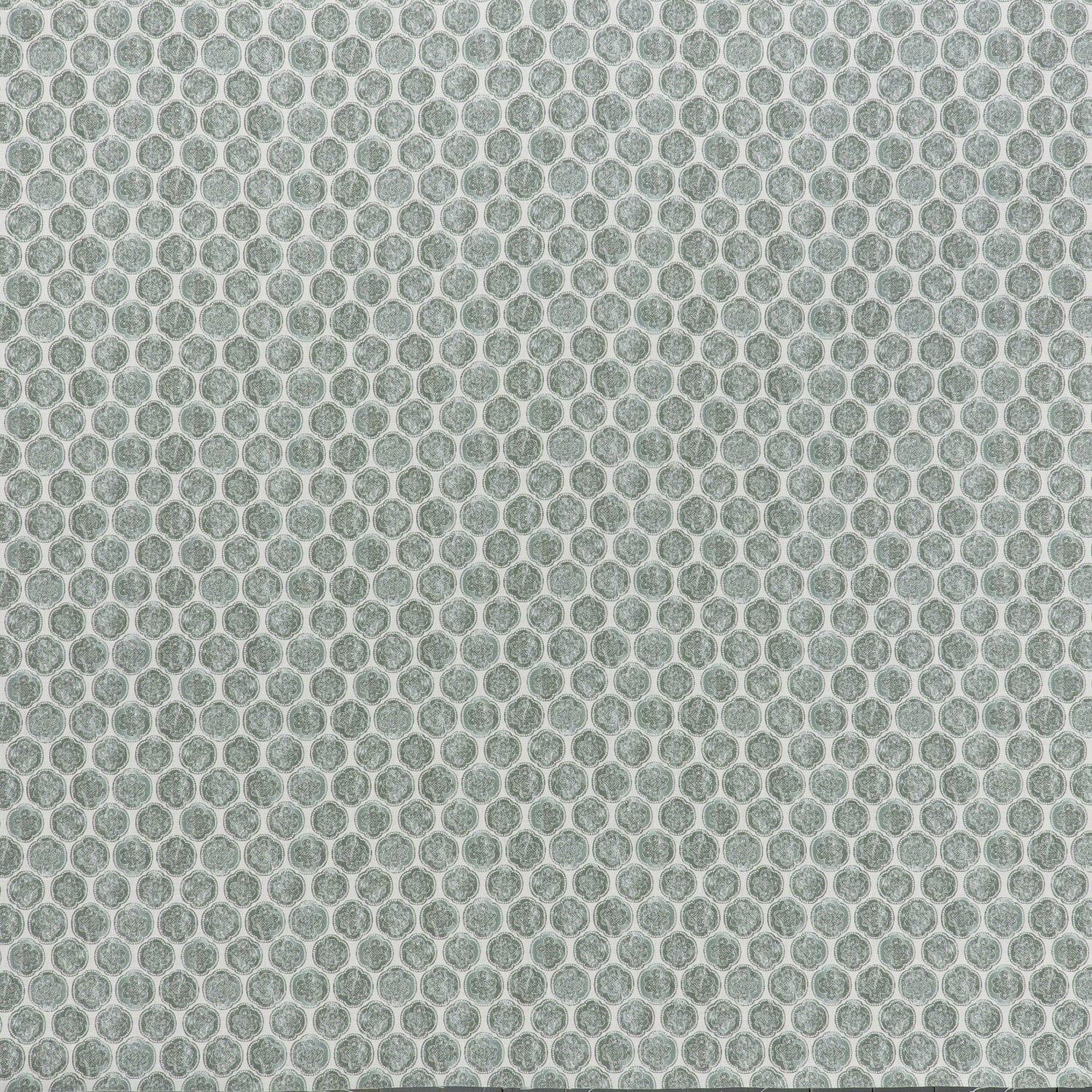 printed linen fabric in a repeating knotted pattern in jade on a white field.