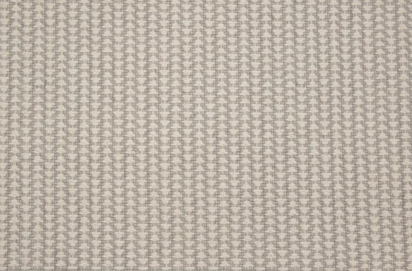 Broadloom carpet swatch in a textured pattern light grey color