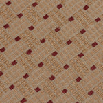 Detail of an embroidered fabric in a dashed basketweave design in tan with red accents.