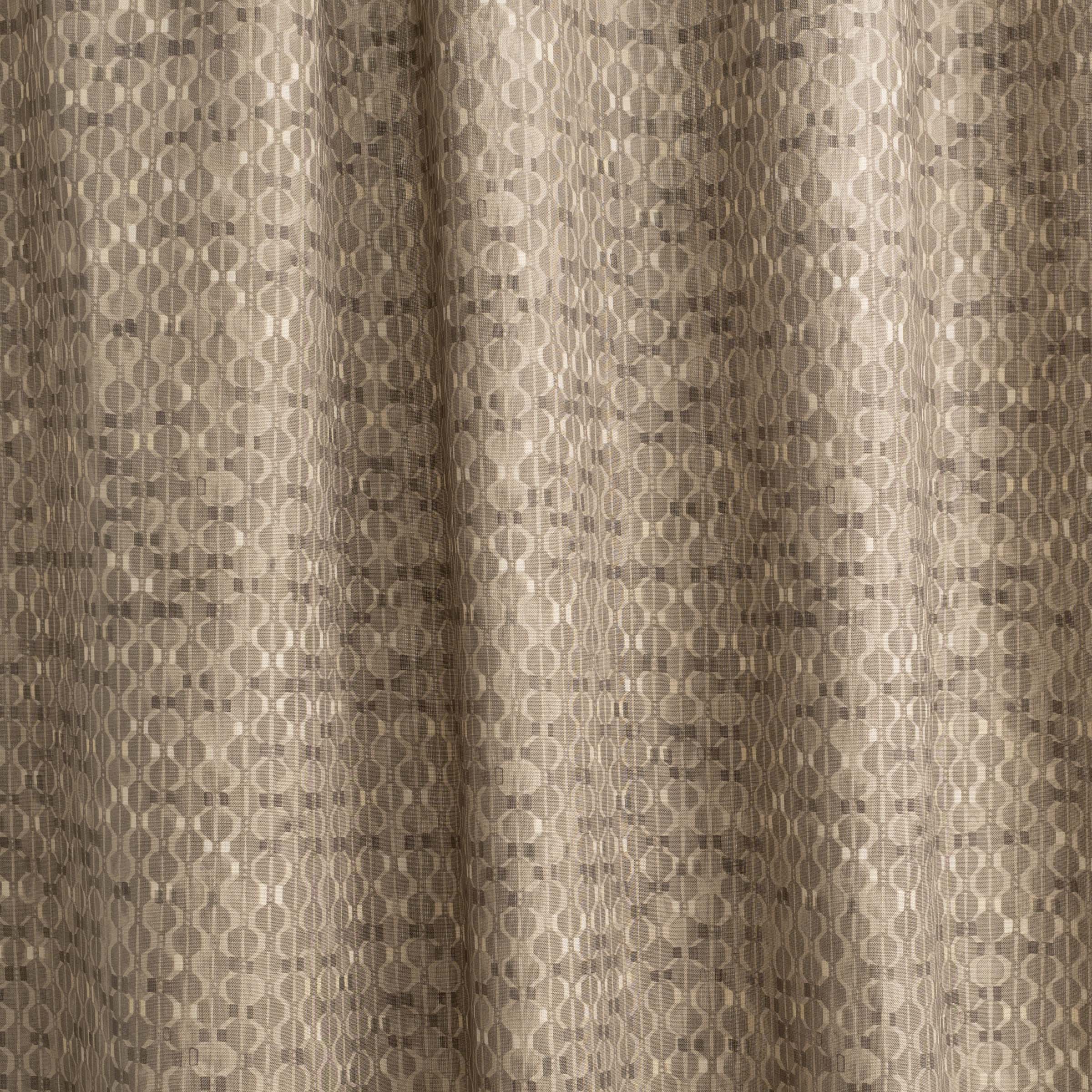 Draped fabric yardage in a textural geometric print in shades of brown on a brown field.