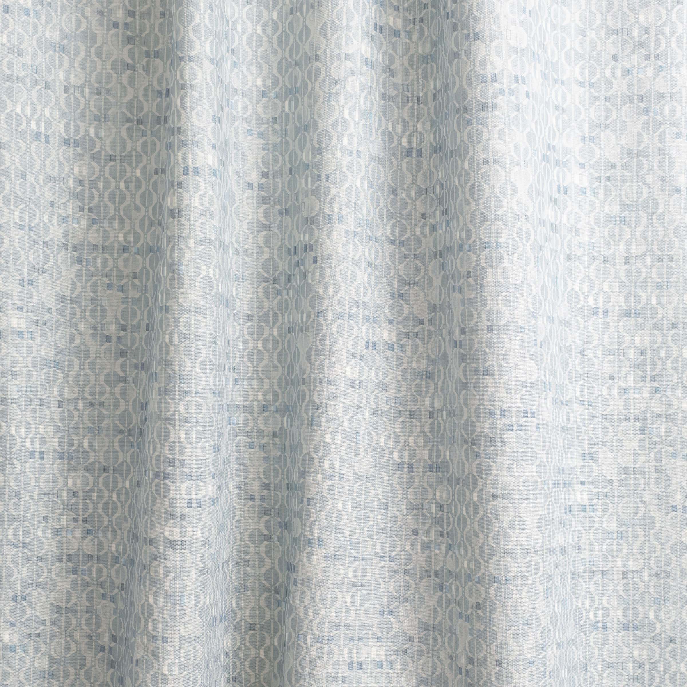 Draped fabric yardage in a textural geometric print in shades of light blue