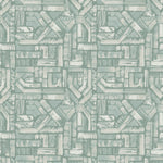 Detail of fabric in an absract geometric pattern in shades of cream and turquoise.