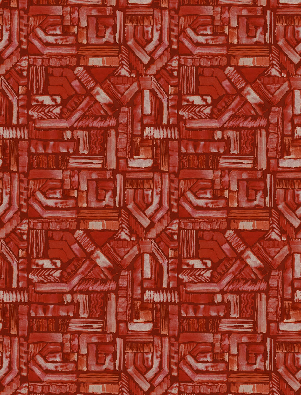 Detail of fabric in an absract geometric pattern in shades of red.