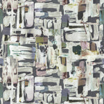 Detail of fabric in an abstract layered paint blotch print in shades of gray, white, olive and purple.