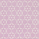 Fabric in a floral lattice print in cream on a light purple field.
