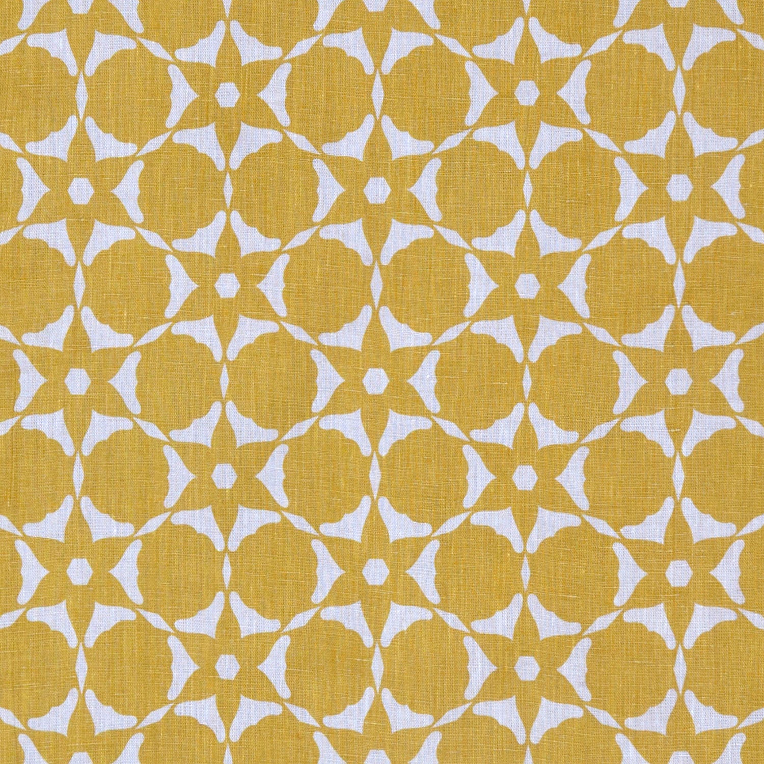 Fabric in a floral lattice print in white on a mustard field.