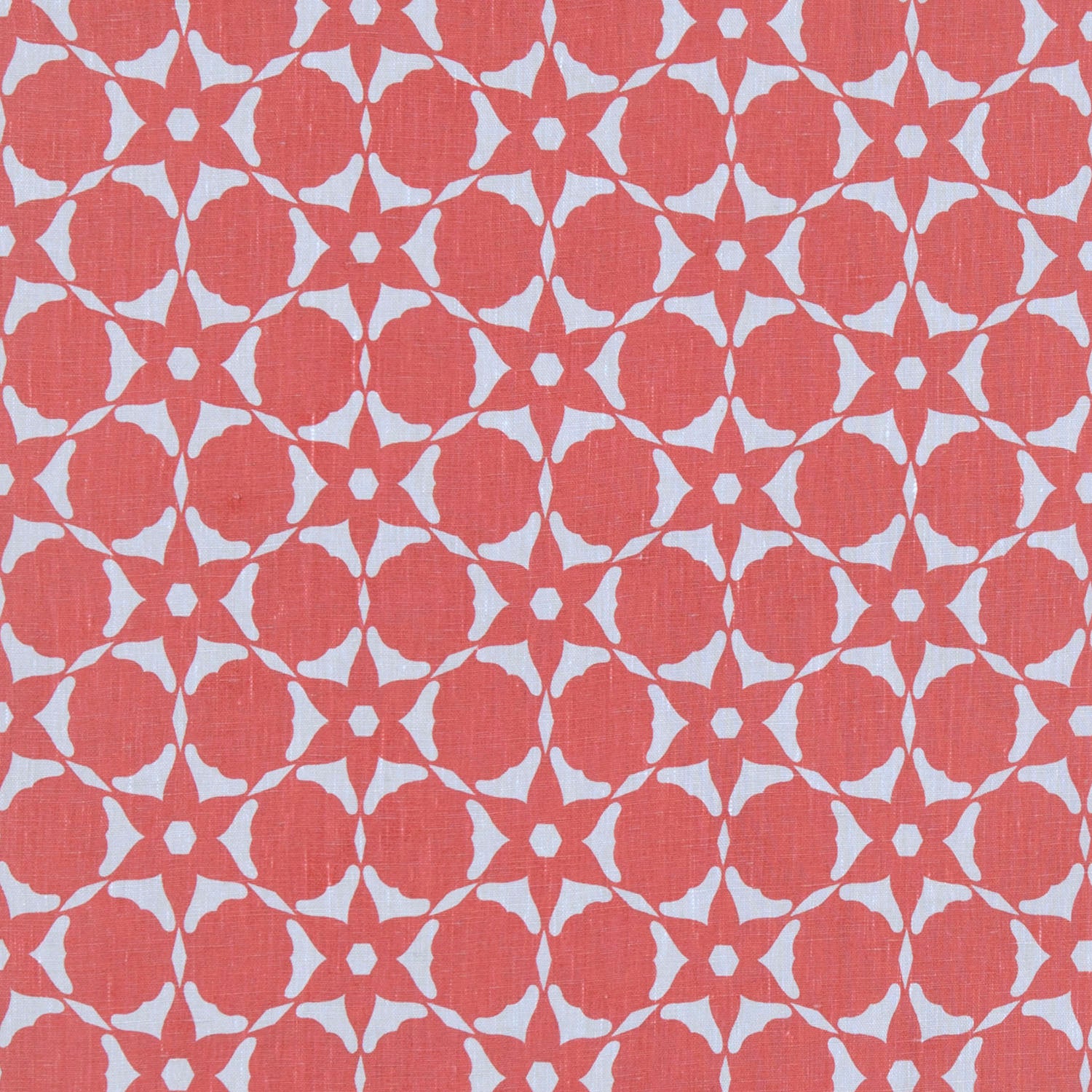 Fabric in a floral lattice print in light blue on a coral field.