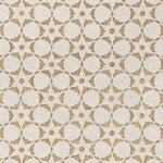 Fabric in a floral lattice print in bronze on a cream field.