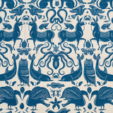 Patterned fabric with animals and sea creatures in blue on a white background