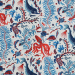 Nautical-themed fabric pattern with red, blue, and navy sea creatures on a white background.