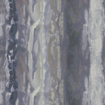 Detail of fabric in an abstract paint swatch print in shades of purple, blue and gray.