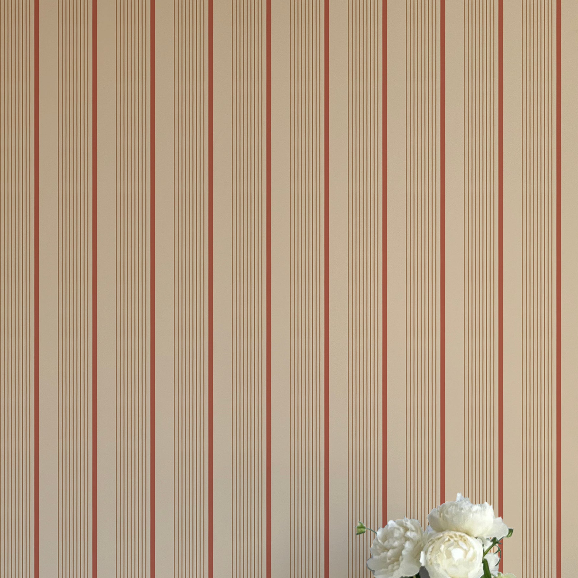 Striped wallpaper with a vase of flowers in the corner