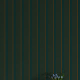 Vase with flowers against a dark green striped wall